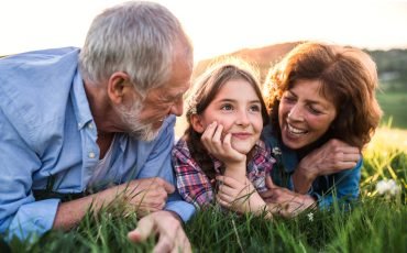 senior-couple-with-granddaughter-outside-in-TWEXCK4.jpg